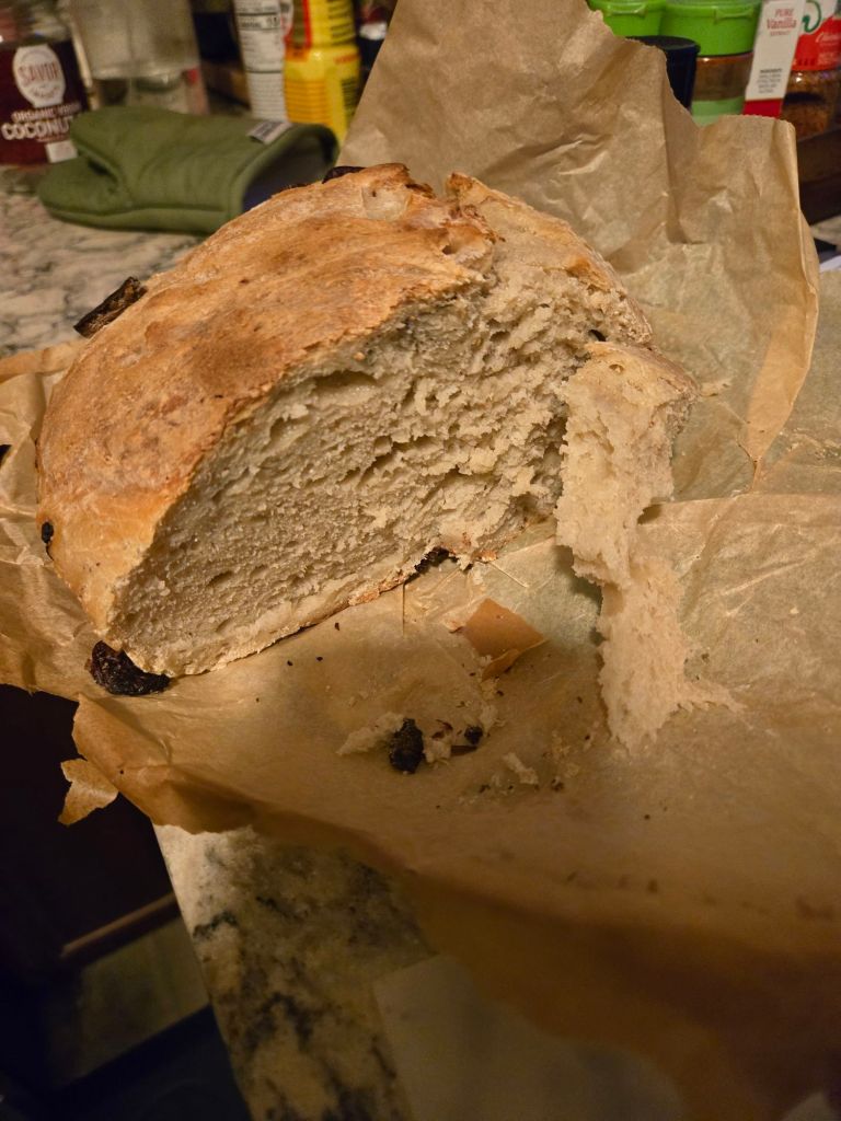 My best sourdough bread yet with a slightly toasted top and some olives within